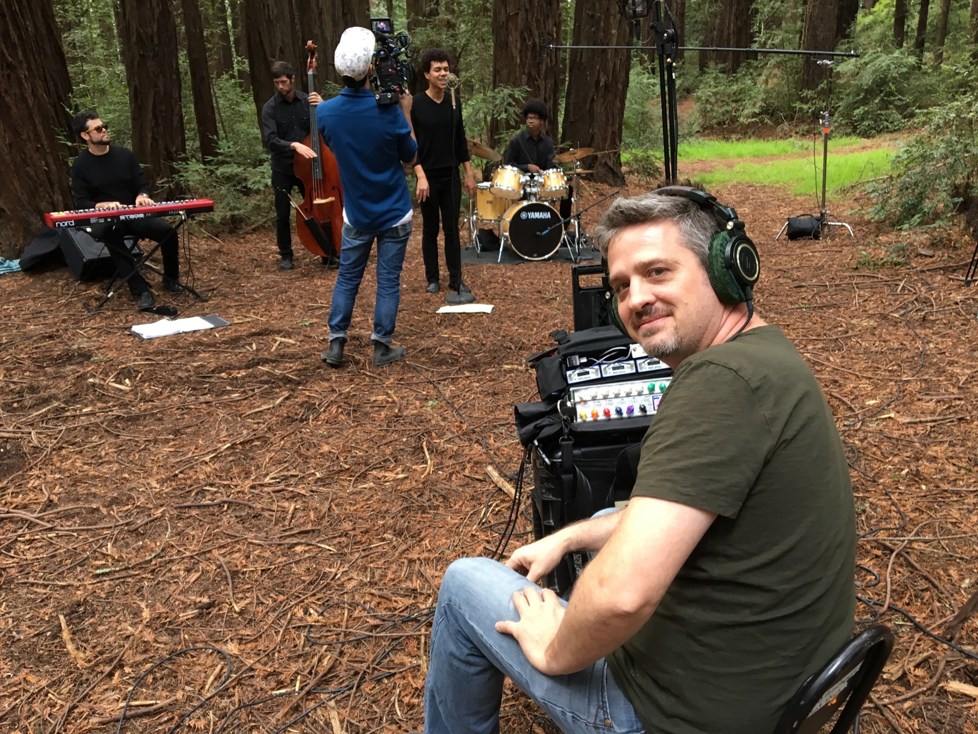 Michael Martin recording the Kalil Wilson Ensemble among redwood trees